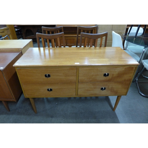 52 - A teak four drawer sideboard