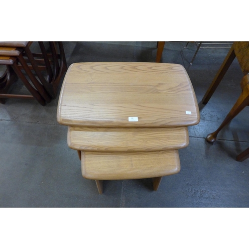 60 - An Ercol Blonde ash nest of tables