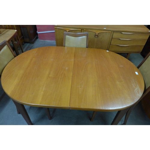 63 - A G-Plan teak extending dining table and four chairs