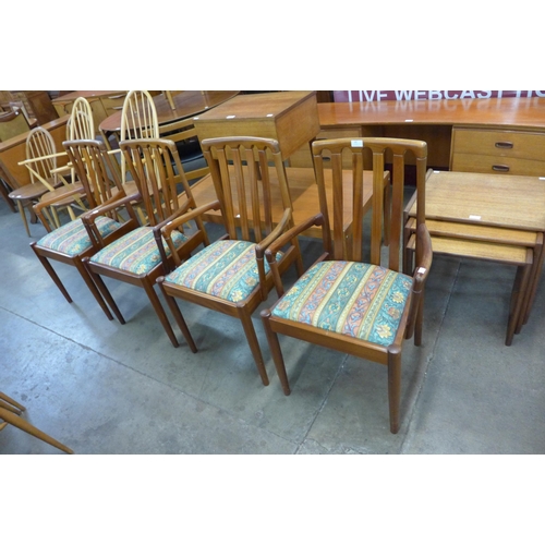 65 - A set of four teak dining chairs