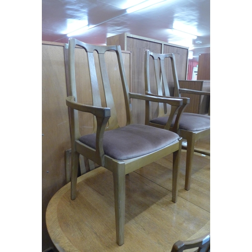 71 - A Nathan teak extending dining table and a set of six chairs