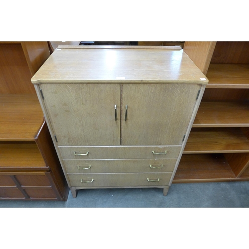 84 - A Lebus light oak tallboy