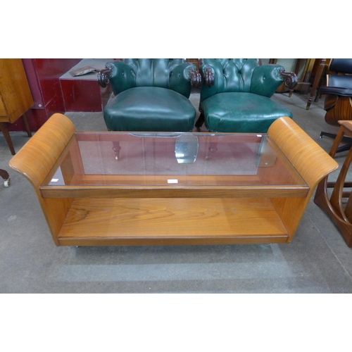 9 - A G-Plan teak and glass topped rectangular tulip coffee table