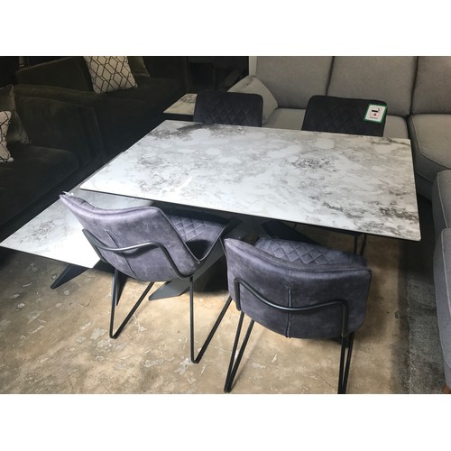 1428 - A Kos 130cm dining table with a set of four grey chairs  *This lot is subject to VAT