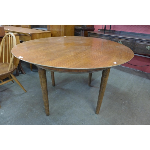 48 - A teak circular dining table