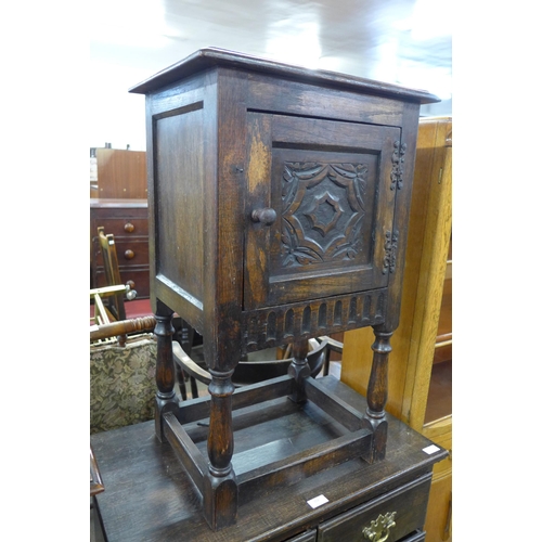 155 - A small 17th Century style carved oak cabinet