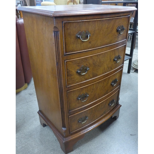 169 - A small burr walnut bow front chest of drawers