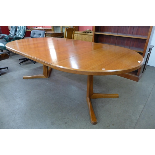 35B - A Danish teak extending dining table