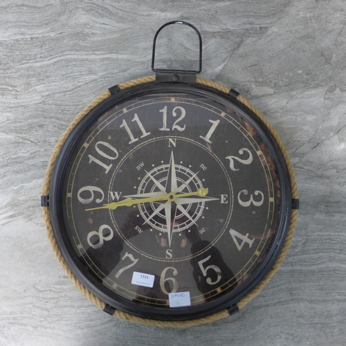 1314 - A black metal and rope industrial style clock depicting a compass