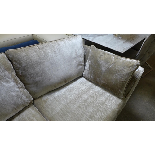 1469 - A champagne crushed velvet three seater sofa