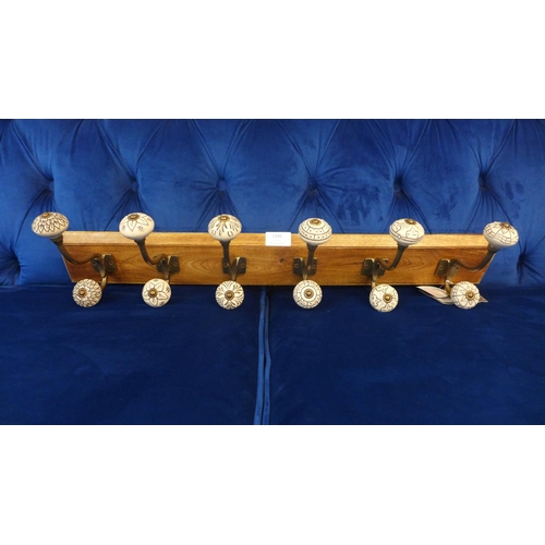 1523 - A rack of six coat hooks with ceramic knobs (HH574624)   #