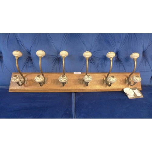 1523 - A rack of six coat hooks with ceramic knobs (HH574624)   #