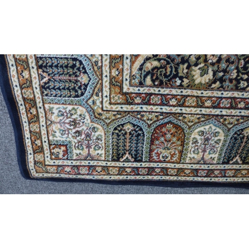 1533 - A blue ground Royal Palace rug, central medallion design 195cm x 135cm