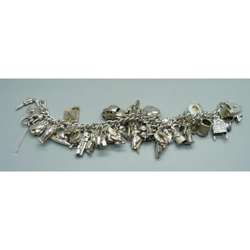 1008 - A silver charm bracelet, 120g