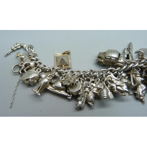 1008 - A silver charm bracelet, 120g