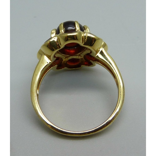 1009 - A silver gilt and garnet Midas ring, Q, with certificate