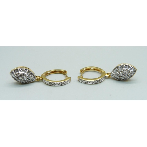 1014 - A pair of silver gilt and diamond drop earrings