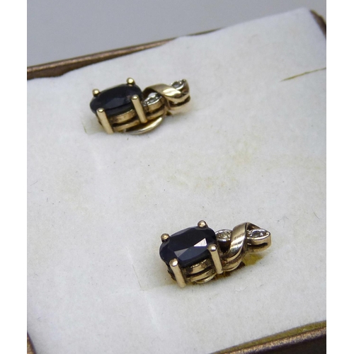 1016 - A pair of 9ct gold, sapphire and diamond stud earrings