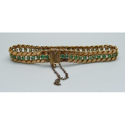 1017 - A 14k gold and forty-six emerald bracelet, 11.9g, marked 14 and 585, 18cm