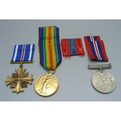 1025 - Three medals; a WWI Victory medal, K-48520 J.N. Petrie Sto. 1. R.N., a U.S. Distinguished Flying Cro... 