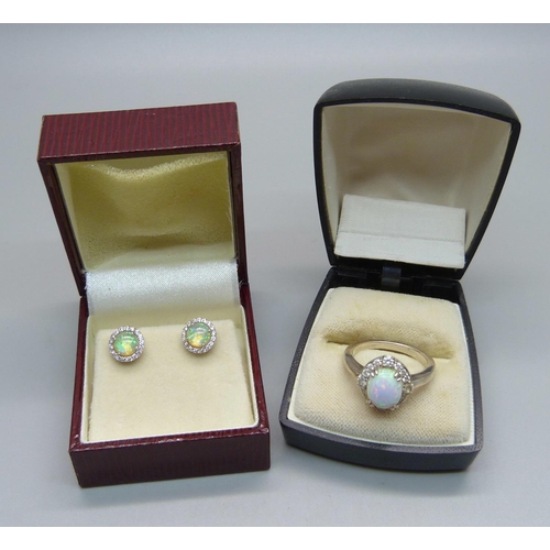 1030 - A silver and synthetic opal ring and earrings, ring size Q