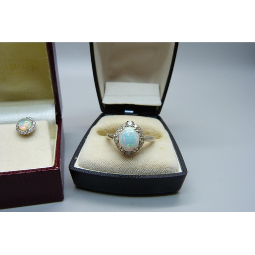 1030 - A silver and synthetic opal ring and earrings, ring size Q