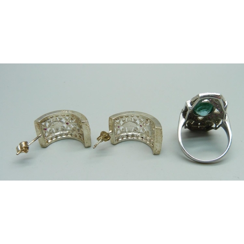 1035 - A silver topaz and ruby ring, Q, and a pair of silver and ruby earrings