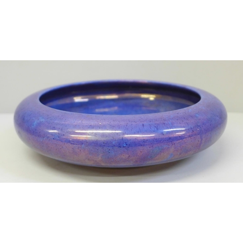 607 - A Moorcroft purple/blue lustre shallow bowl, 20.5cm