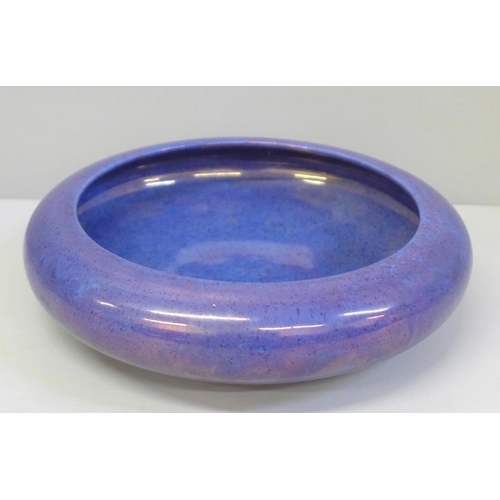 607 - A Moorcroft purple/blue lustre shallow bowl, 20.5cm