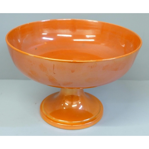 612 - A Moorcroft orange lustre pedestal bowl, a/f (hairline in main bowl), 22cm