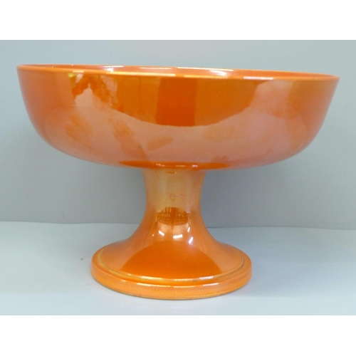 612 - A Moorcroft orange lustre pedestal bowl, a/f (hairline in main bowl), 22cm