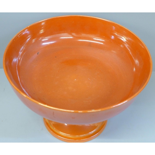 612 - A Moorcroft orange lustre pedestal bowl, a/f (hairline in main bowl), 22cm