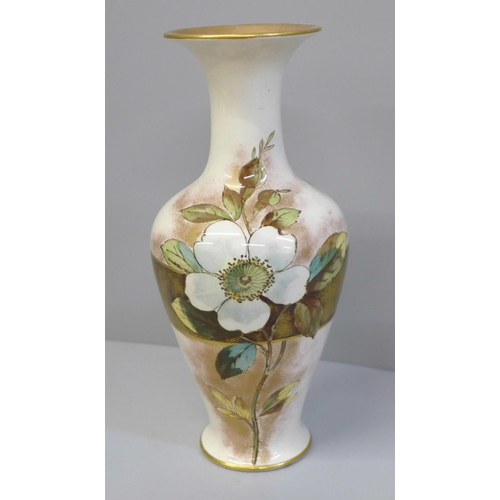 616 - A Doulton Christmas Rose faience vase, registration lozenge to base, 19.5cm