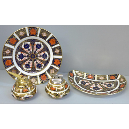 628 - Two Royal Crown Derby Imari table lighters and a side plate plus crescent dish