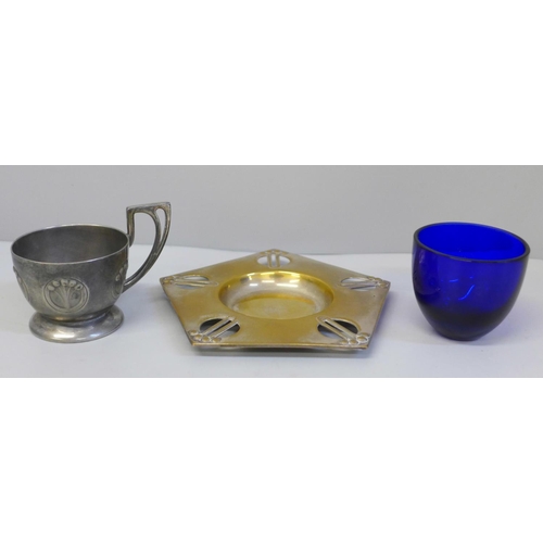 648 - A WMF Art Nouveau cup and saucer with blue glass liner