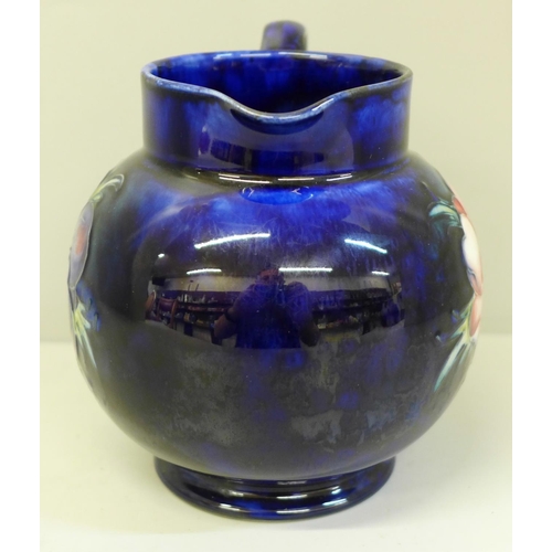 649 - A Moorcroft Peony pattern jug in cobalt blue, 12cm, with a box