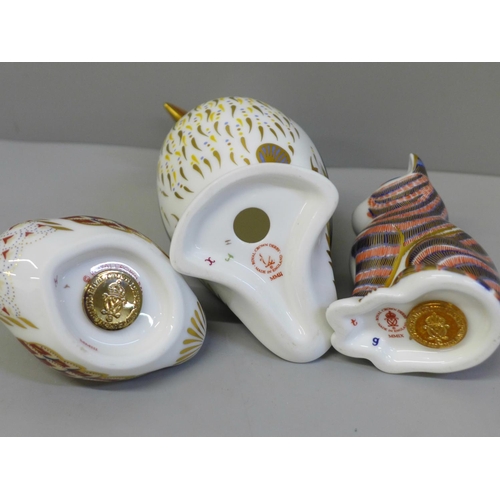 650 - Three Royal Crown Derby paperweights, Puffin (second), cat with gold hexagonal stopper and duckling ... 