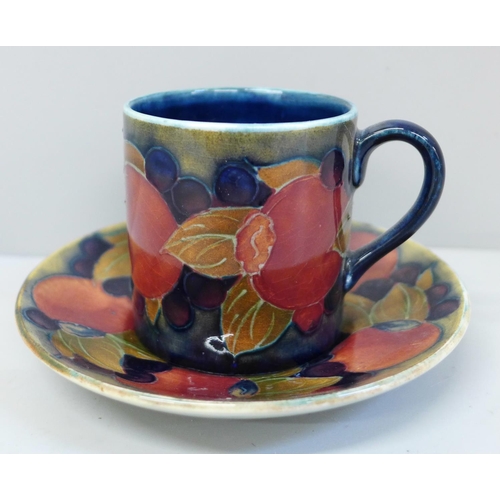 652 - An early 20th Century Moorcroft Pomegranate pattern coffee can and saucer