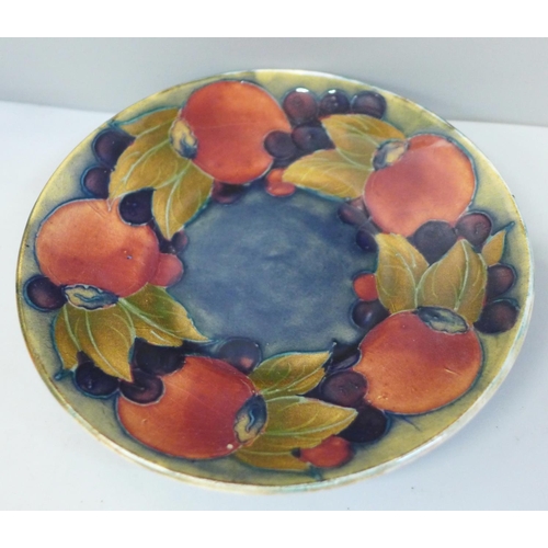 652 - An early 20th Century Moorcroft Pomegranate pattern coffee can and saucer