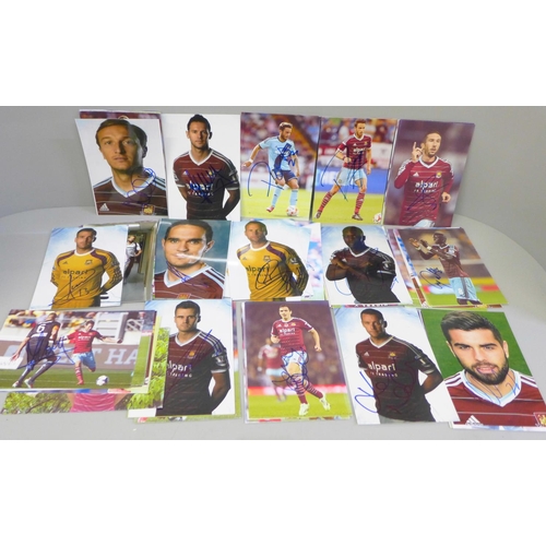 653 - Seventy-one signed photographs of West Ham United footballers, including Mark Noble (x2)