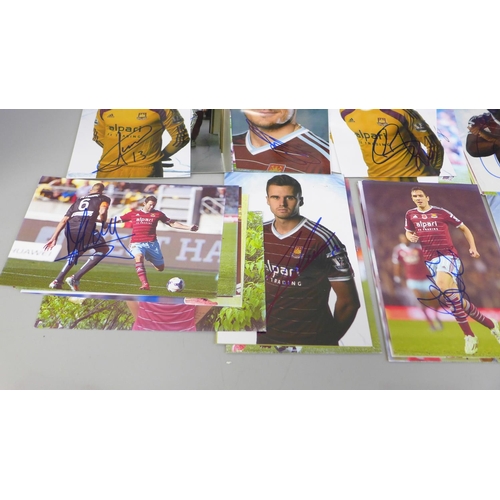 653 - Seventy-one signed photographs of West Ham United footballers, including Mark Noble (x2)