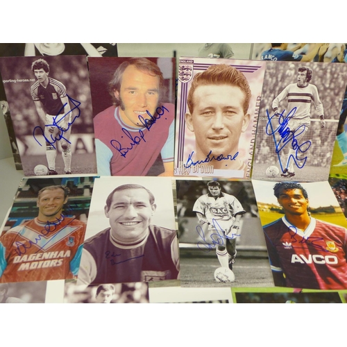 654 - Thirty-six signed photographs of West Ham United footballers, including Martin Peters, Billy Jenning... 