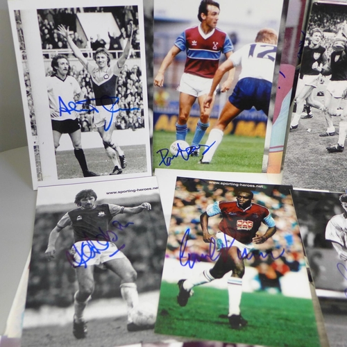 654 - Thirty-six signed photographs of West Ham United footballers, including Martin Peters, Billy Jenning... 