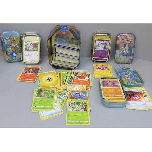 663 - Pokemon cards: mixed sets, 468 cards in three small and one medium tin