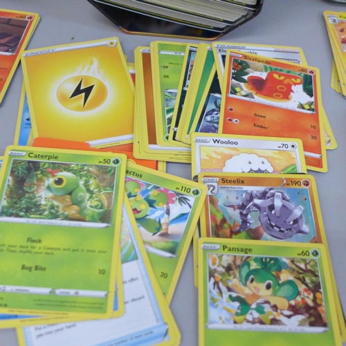 663 - Pokemon cards: mixed sets, 468 cards in three small and one medium tin