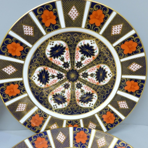 671 - Four Royal Crown Derby Old Imari dinner plates, one second quality