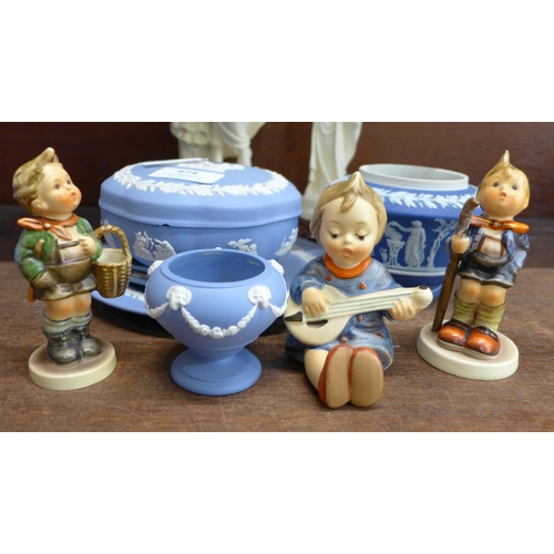 674 - Three Goebel figures, Wedgwood Jasperware porcelain (5) and two resin figures of maidens