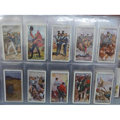 726 - Cigarette cards; an album of military cigarette cards, with ten complete sets including Wills Allied... 