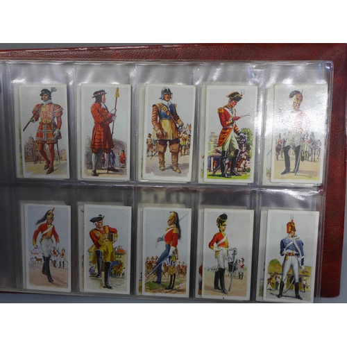 726 - Cigarette cards; an album of military cigarette cards, with ten complete sets including Wills Allied... 