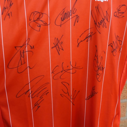 726C - A signed Nottingham Forest shirt containing signatures from seventeen members of the 2018-19 squad i... 